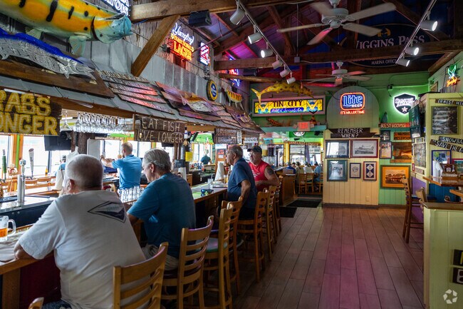 People enjoying close by attraction Tin City's several casual waterfront restaurants.