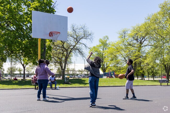 Buckeye-Shaker locals enjoy the newly refinished basketball court at Luke Easter Park.