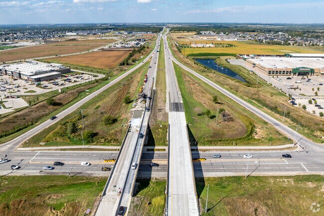 Highway 141 connects to Interstate 80/35, which will get you anywhere in the Des Moines metro.