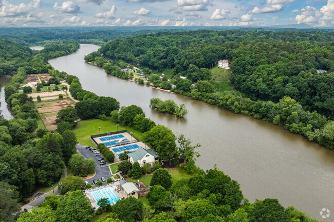 Huntcliff offers stunning aerial views of the Chattahoochee River, highlighting its unique access to water-based recreation and scenic beauty.