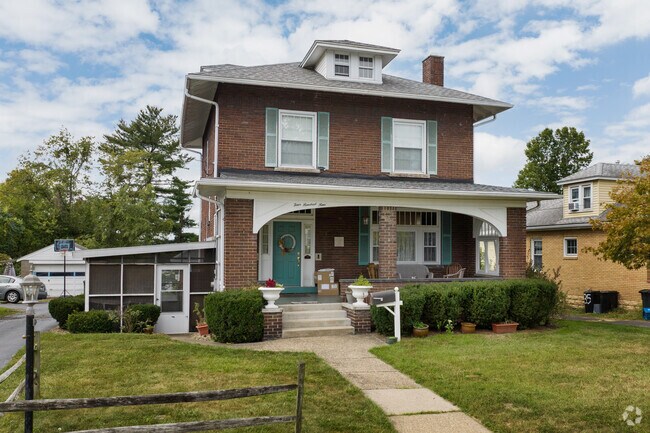 American Foursquare and Colonial Revival homes appear across town.