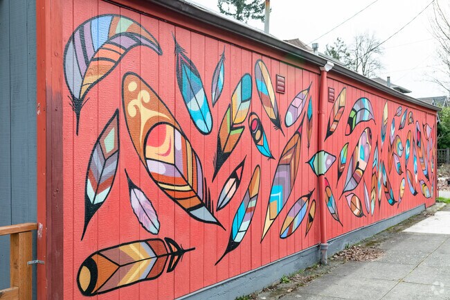 Mural with colorful feathers over the building in Concordia, Oregon.