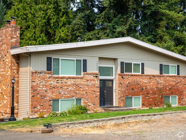 Cute split-level homes feature brickwork and wooden details.