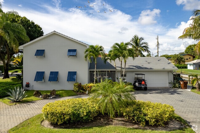 A Greek Revival homes can be found in the neighborhood of Lake Clarke Shores, FL.
