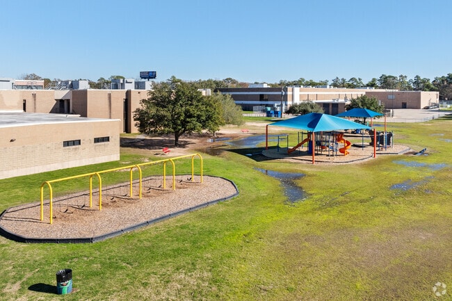 Climb, slide, and swing in Benfer Elementary School's play space.