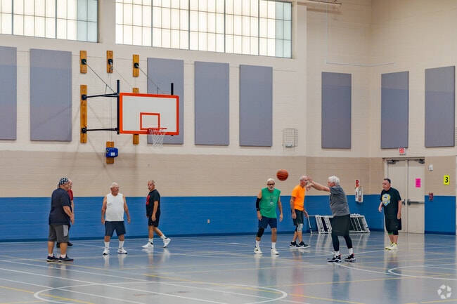 Englewood residents enjoy a game of indoor basketball at the Englewood recreation center.