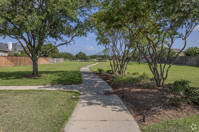 Northpointe residents enjoy strolls along the paved paths in Village Creek Community Park.