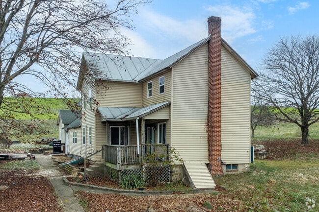 A rustic countryside home with vintage charm; perfect for peaceful rural living.