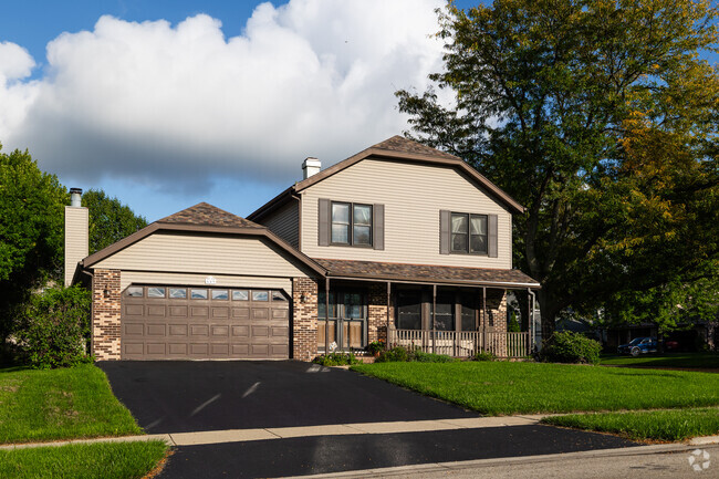 A brown farmhouse is another style of architecture seen in Ivanhoe, IL.