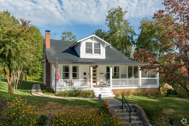 A Cross-Gabled Craftsman-style home graces a hill in South Marshall, NC.