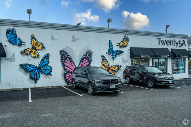 The butterfly moral decorates the side of this retail store.