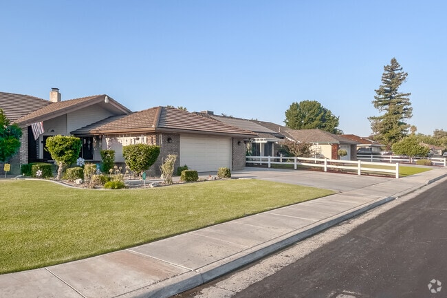 Wide lawns and driveways distinguish the newest suburban developments of Greenfield.