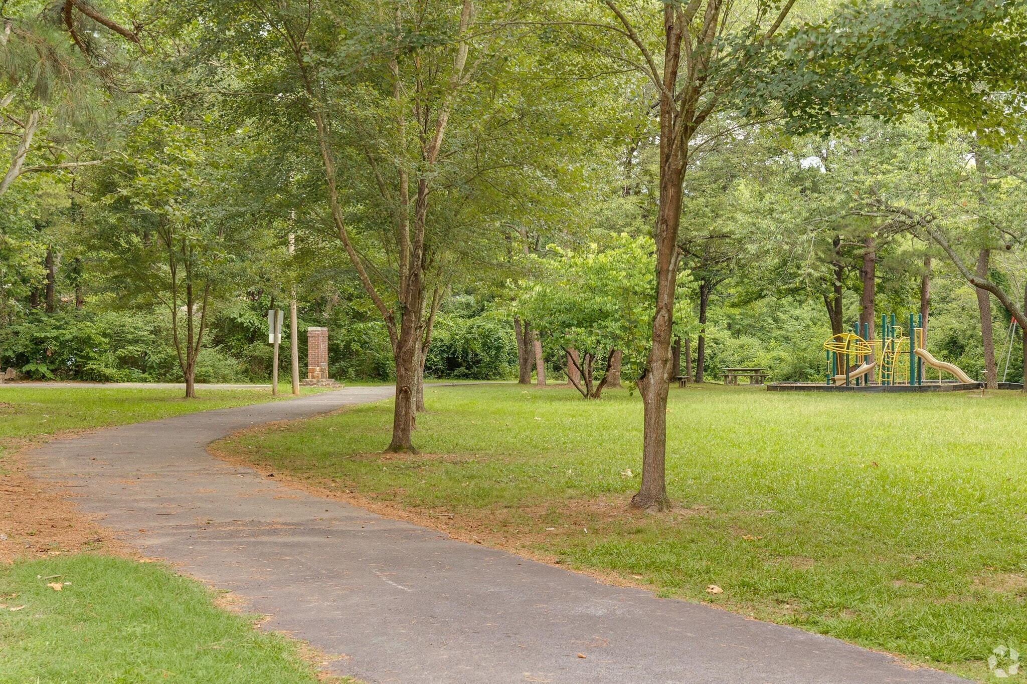 Surround yourself with nature on the paved walking path at Birchwood Park in Walnut Valley.