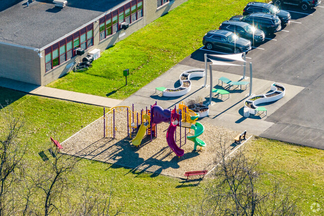 The rear of University Park Elementary School includes a colorful playground for students.