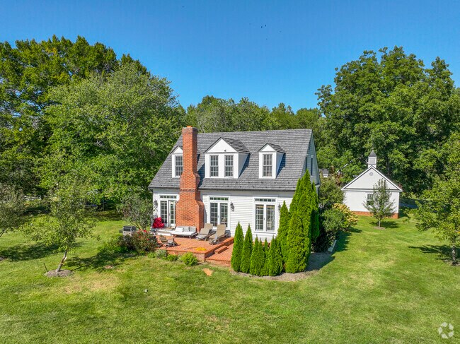An idyllic cottage in Cismont includes a small brick patio.