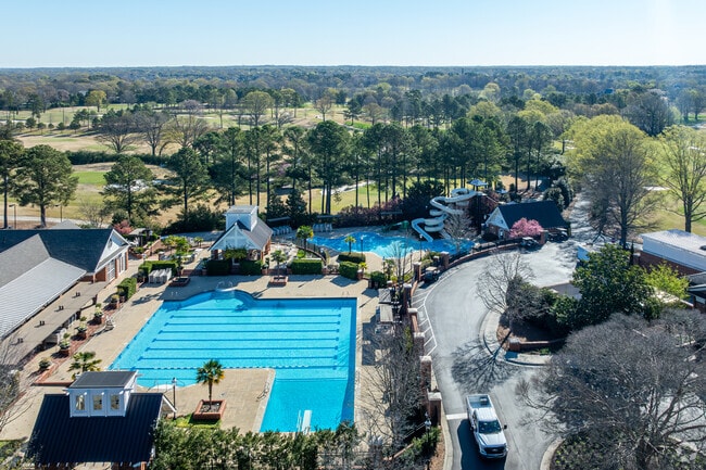 Locals enjoy the poll and tennis courts at Carmel Country Club in Montibello.
