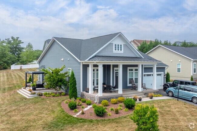 Newly constructed homes have well landscaped yards and big front porches in Massanetta Springs.