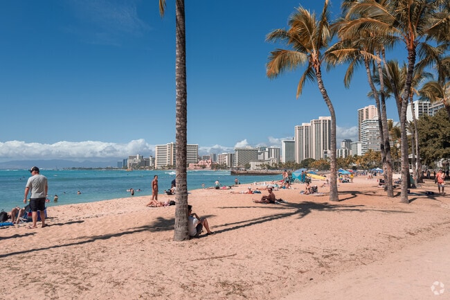 Relax on the golden sand on Kuhio Beach in Waikiki.