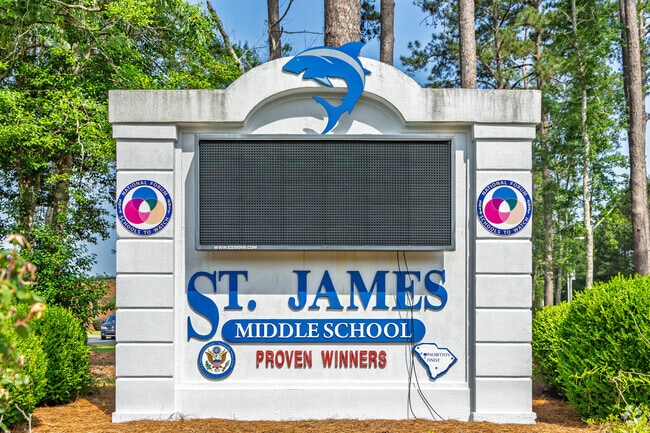The digital sign at St. James Middle School highlights important student announcements.