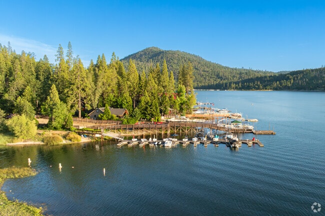 All the boats have been docked at the marina of Bass Lake while the sun goes down.