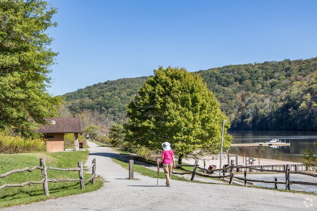 Laurel Hill State Park lies 12 miles north for hiking and lake days.
