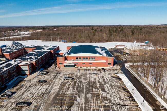 The swimming pool building at Sandy Creek High School in Sandy Creek can be seen from outside.