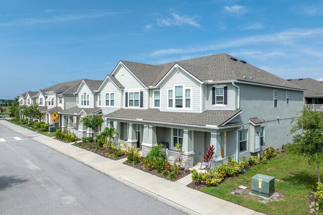 A row of new Randal Park townhomes features beautiful landscaping.