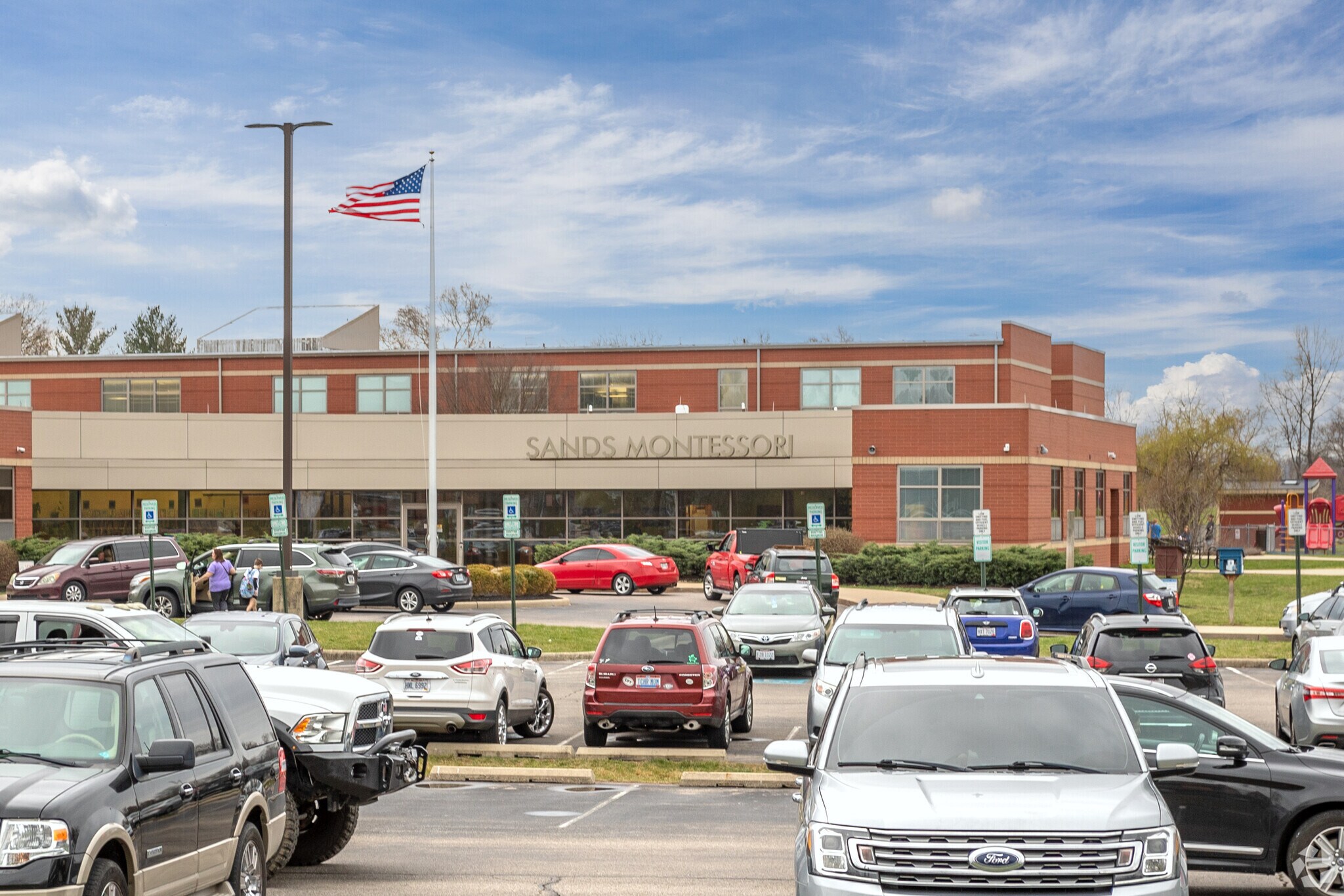 The parking lot view of Sands Montessori Elementary School nearby  nearby Mount Washington, OH.