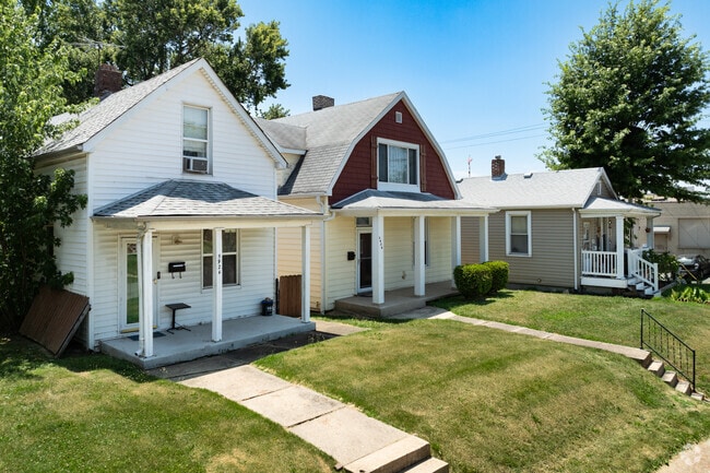 A row of cozy bungalows line a residential street in Cheltenham.