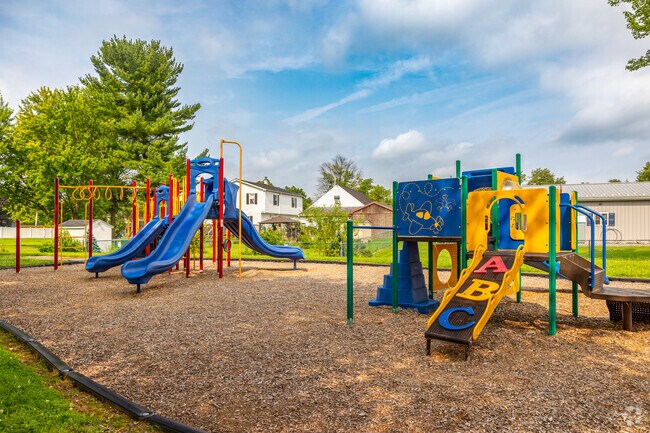 Let the kids run themselves tired on the jungle gym at Spruce Street Park in Beech-Wilson.
