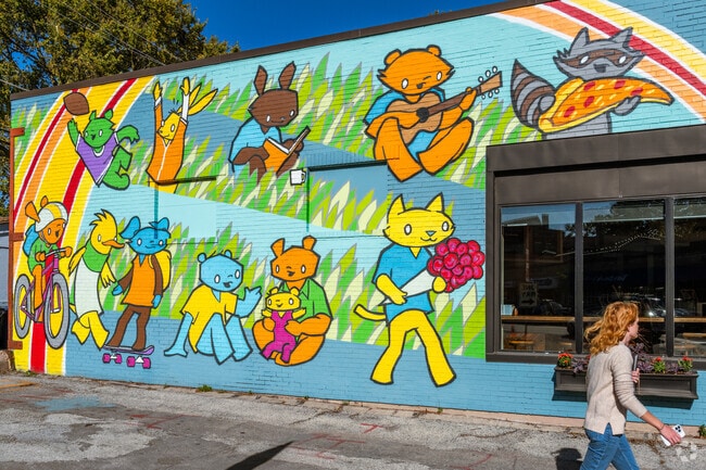 Many Central Street businesses have colorful murals painted on the side of their buildings.