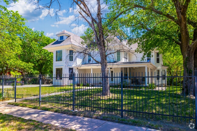 Homes in Fairmount are shaded by trees and feature large yards.