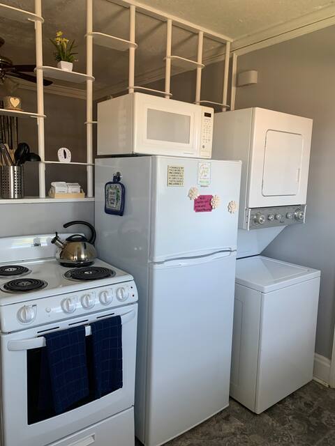 Kitchen: electric range, new refrigerator, washer/dryer, microwave, blender, toaster, coffee maker