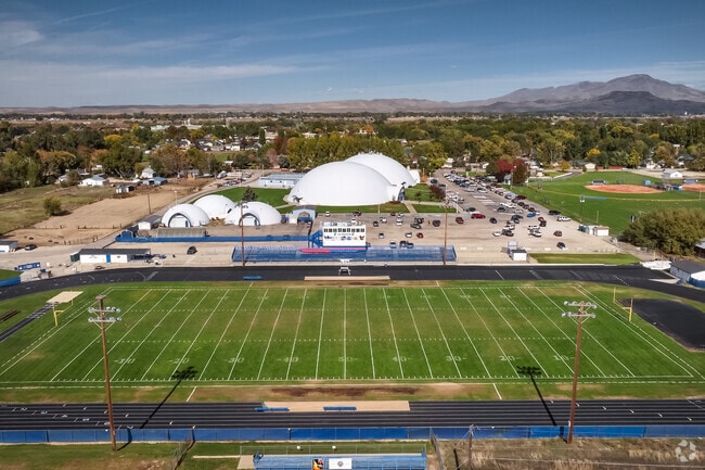 Emmett High School has several sports fields including a football field.