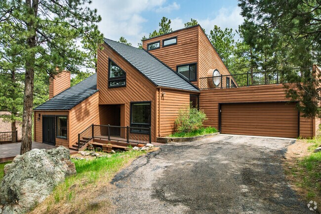 Discover mountain homes with modern cabin designs in Genesee Central.