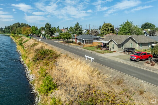 Rows of homes line the Willamette River in Harrisburg, Oregon.