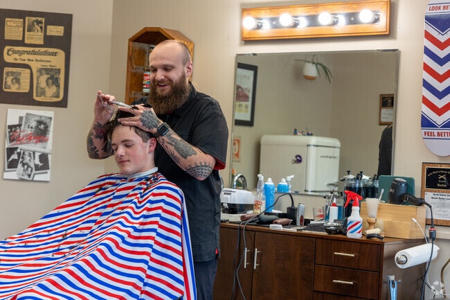 Locals can get a haircut at Trollwood Barbers, right in the center of the neighborhood.