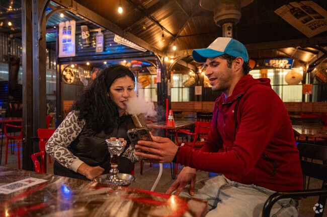 Indulging in flavorful moments at the Sandwich Spot with a delightful hookah session.