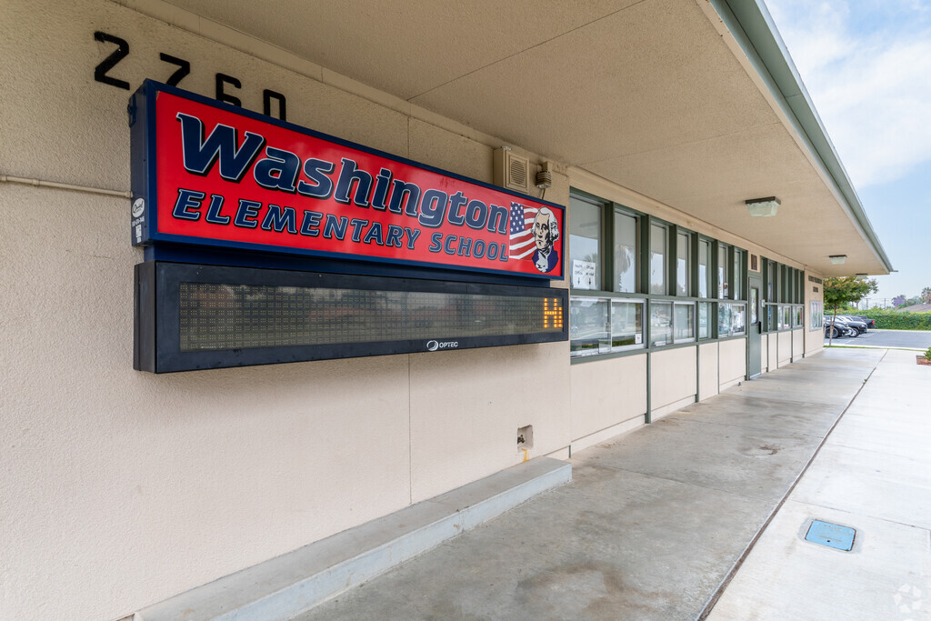The prominent Washington Elementary School signage stands in front of the office.
