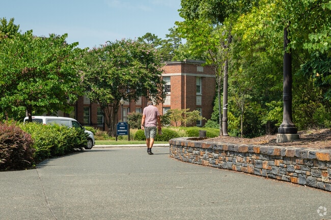 Pedestrians cross Duke University near Garrett.