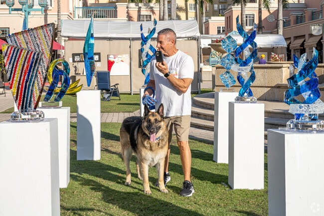 Your furry dogs enjoy the Museum Art Festival in Mizner Park near Boca Raton Square.