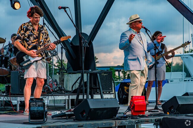 The band at the summer concert series at the pier entertains Forest Hills South residents.