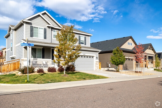 Homes with well-manicured lawns line the streets of The Meadows in Castle Rock.
