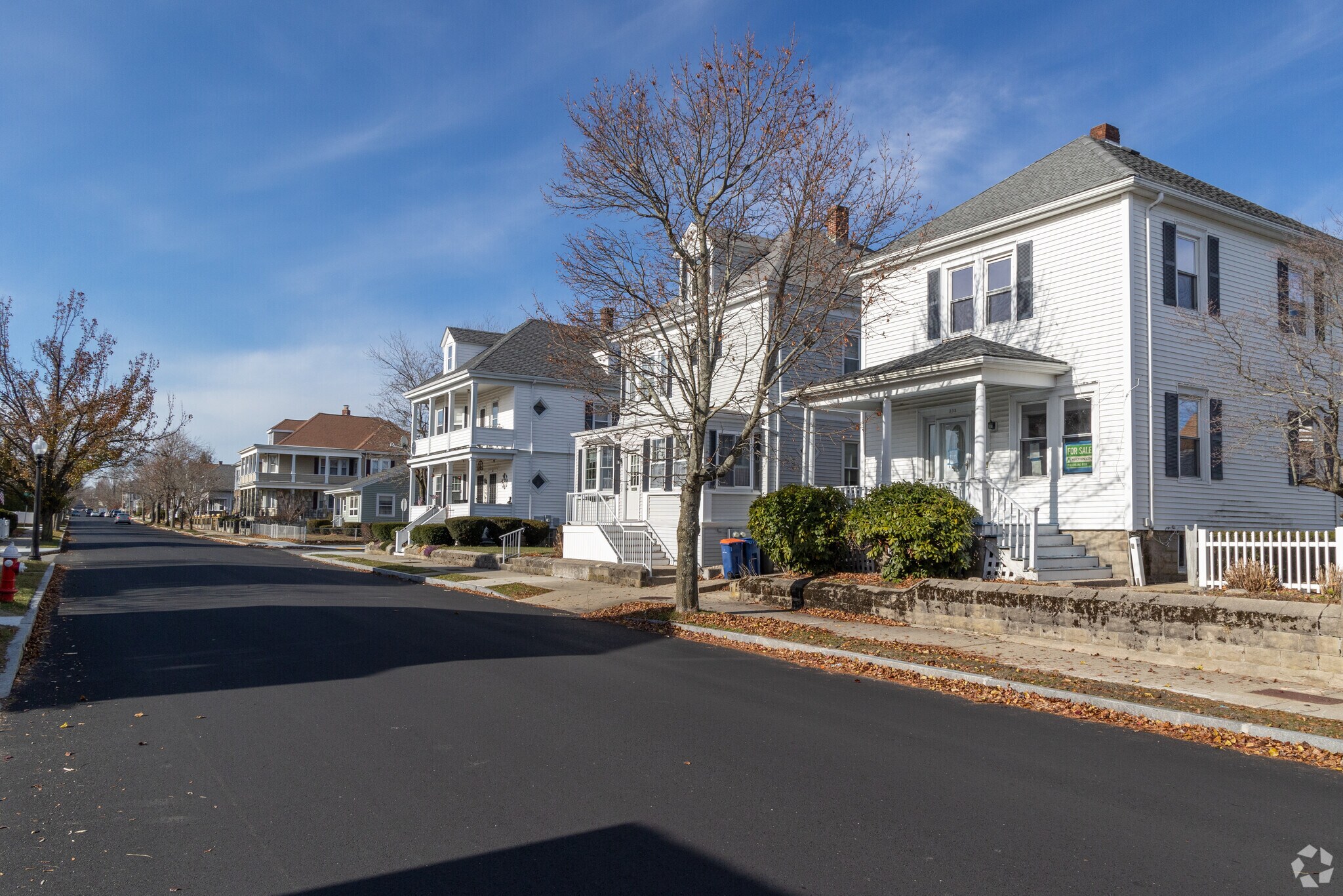 Organized rows of homes are lined on broad streets in Acushnet.
