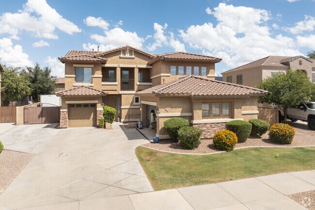 Clay-tile roofs and warm exteriors echo Southwestern design.