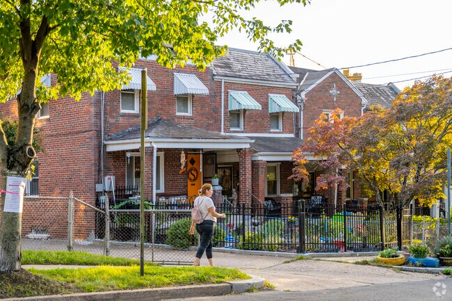 Many of the row homes in Pleasant Hill have small front yards which residents fill with flowers.