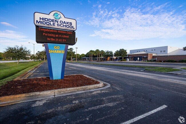 Welcome Hidden Oaks Middle School signage, and parking lot.
