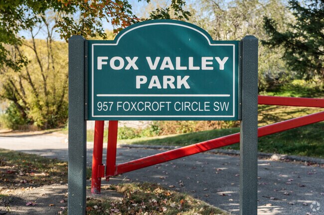 Enjoy tennis at Fox Valley Park's well-maintained courts, nestled in scenic greenery.
