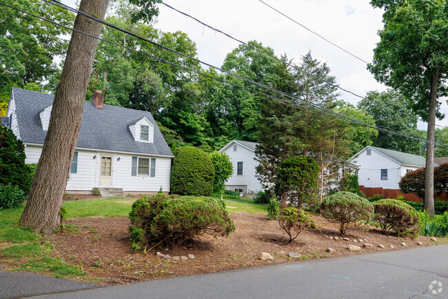 Many homes in Cranbury are tucked away on quiet roads with lush greenery.