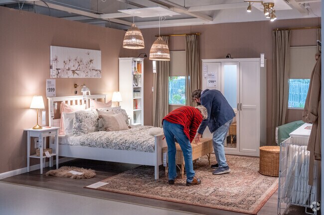 A couple checking out the beds at Ikea in Beltsville.